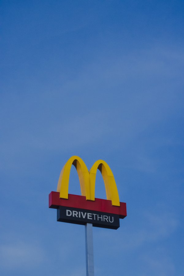 A McDonald's drive thru sign post.