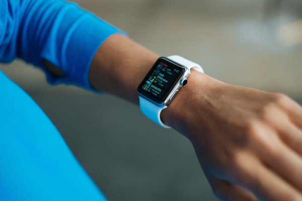 A person wearing an apple smart watch.