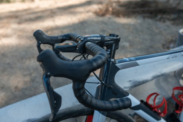 Brake levers on bike handlebars.
