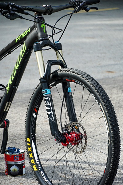A black mountain bike with the bike forks showing at the front.