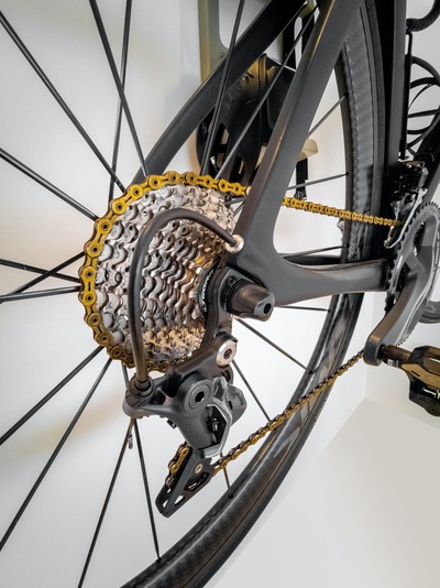 A close-up photo of the rear wheel of a bike showing the gears.